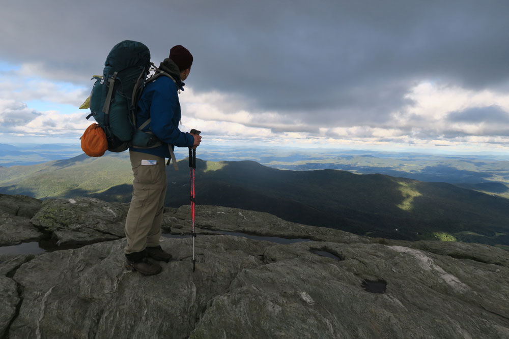 Dawn Chandler hiking Vermont's Long Trail — here, pausing atop Mount Mansfield, Vermont's highest peak. Photo by LT Sole Sister Sylvie "Charger" Vidrine