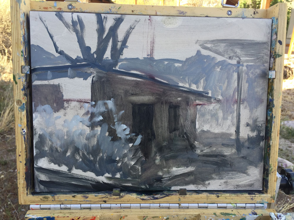 Dawn Chandler's laying in the values on a plein in painting of an adobe pottery shed in Dixon, New Mexico
