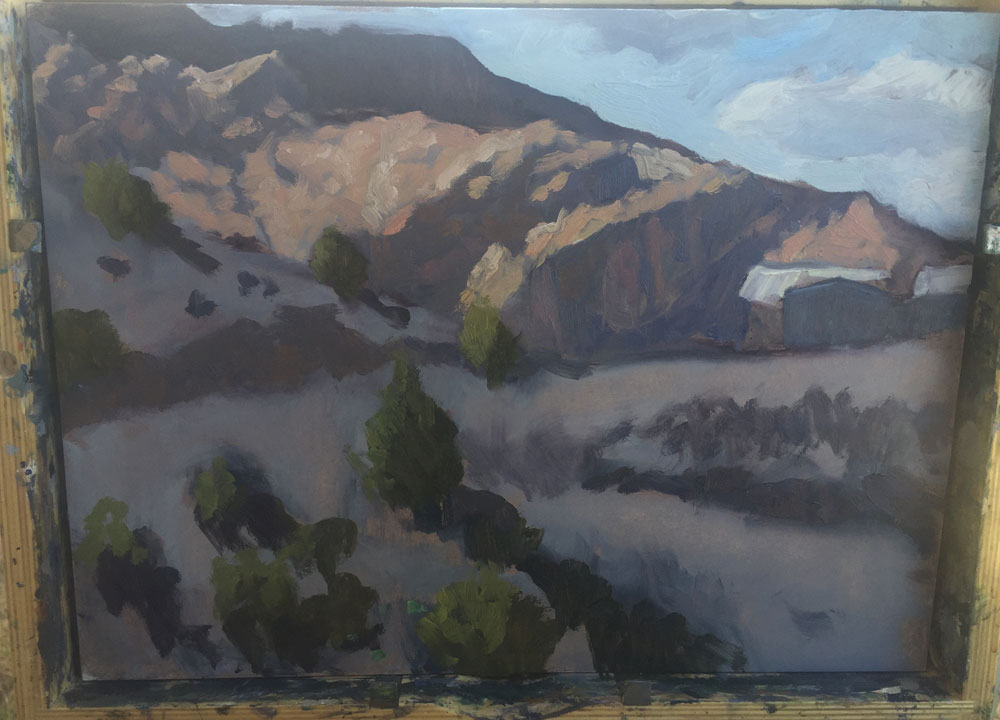 Dawn Chandler's starting to add color in a plein air painting of view in Dixon, New Mexico