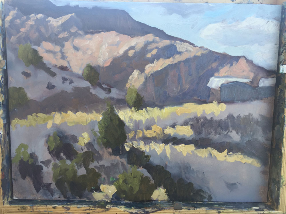 Dawn Chandler adding yet more color to a plein air painting of view in Dixon, New Mexico