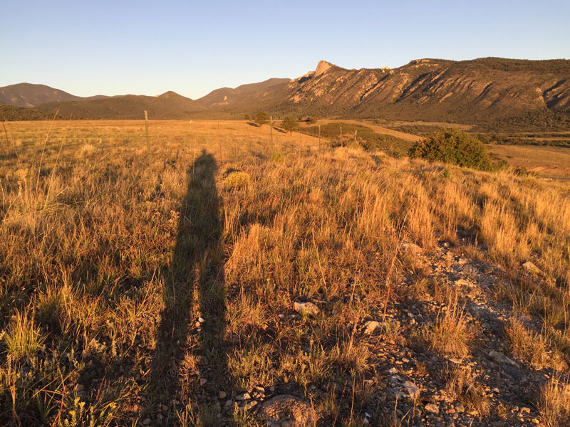 dawn chandler silhouetted against philmont's tooth of time one early september morning