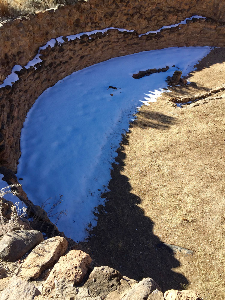 a half-moon of snow shadow photographed by artist Dawn Chandler