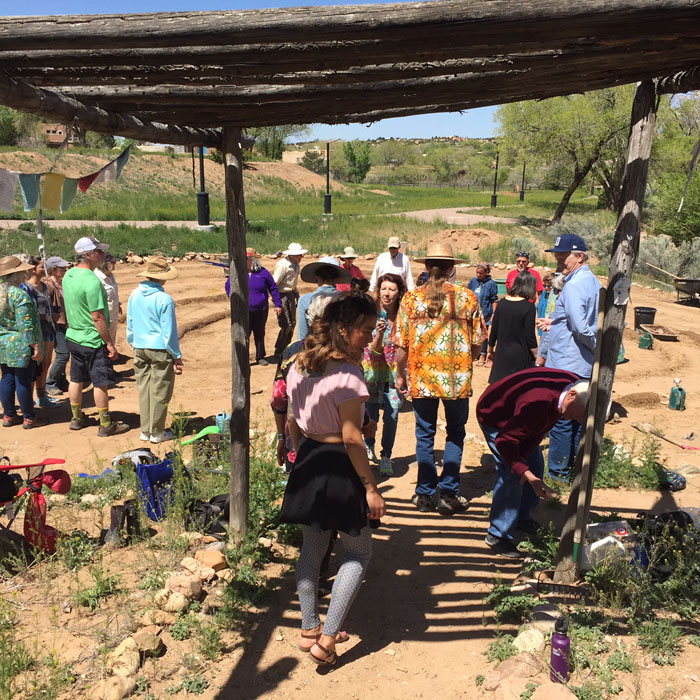 Volunteers and muscians gather for Mud Day at the Frenchy's Park labyrinth in Santa Fe. Photo by Dawn Chandler.