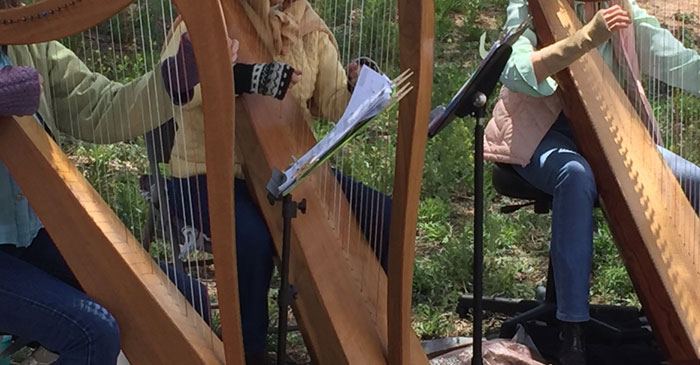 Harpists serenade the walking of the Frenchy's Park labyrinth in Santa Fe on Mud Day. Photo by Dawn Chandler.