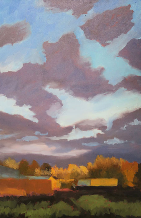 Dawn Chandler further developing the sky in her New Mexico landscape oil painting 'Santa Fe September.'