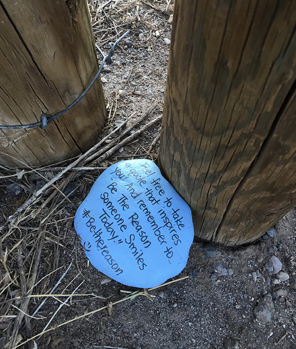 Blue stone quotation art east side of the Sandias