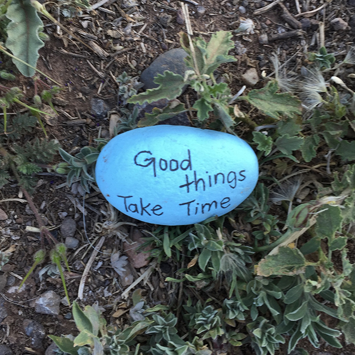 Blue stone quotation art east side of the Sandias