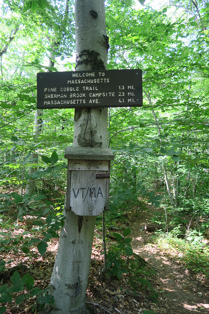 Welcome to Massachusetts sign on the Long Trail. Photo by Dawn Chandler.