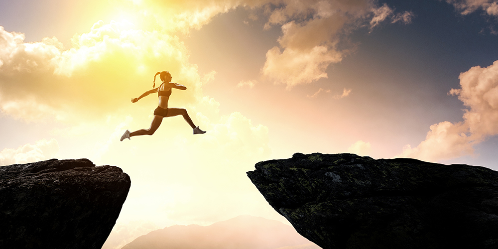 Leaping woman runner image by Sergy Nivens.