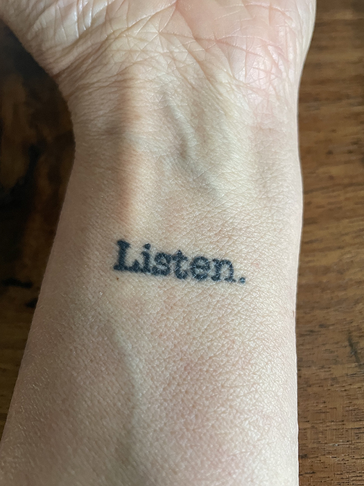 we need to talk: a word, a tattoo and campfire conversations - Listen tattoo on Dawn Chandler's arm. Photo by Dawn Chandler.