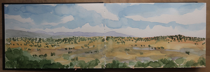 Preparing for the very large triptych project, painting watercolor sketches of big sky at the Caja del Rio, Santa Fe, New Mexico. Watercolor by Dawn Chandler.
