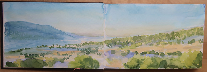 Preparing for the very large triptych project, painting watercolor sketches of big sky at the Caja del Rio, Santa Fe, New Mexico. Watercolor by Dawn Chandler.