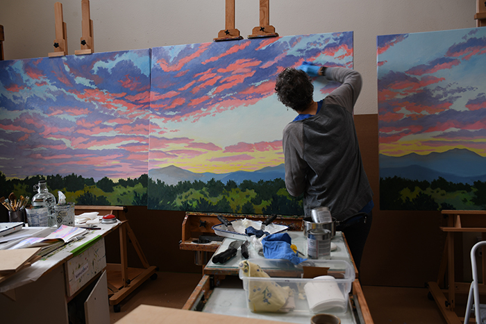 Artist Dawn Chandler varnishes her Very Large Triptych 'Sangre de Cristo Sunrise - Peaceful Magnificence' with Gamblin cold wax.
