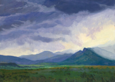 ‘That New Mexico Evening Storm Aura’ original New Mexico landscape painting in oil by Santa Fe artist Dawn Chandler, depicting the Philmont mountains viewed westward across a green meadow in the glowing aftermath of an early-evening summer rainstorm.